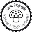 Motiv eines Fliegenpilzes auf einem Holzstempel.