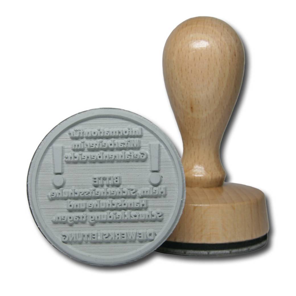 Runder Holzstempel mit einem Durchmesser von 50 mm. Runder Holzstempel mit einem Durchmesser von 50 mm.