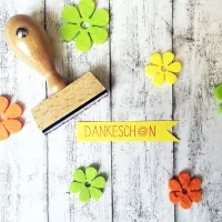 Holzstempel mit dem Schriftzug "Danke"